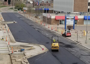 Workers pave street near Sioux Falls city downtown