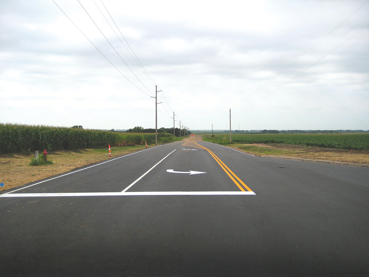 Resurfacing a public road and striping.